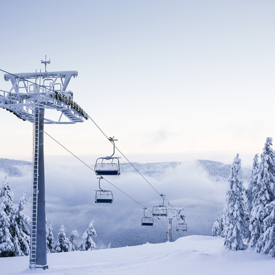Empty chair ski lift on bright winter day picjumbo com